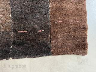 A Tsuktruk carpet from Tibet, likely from the early 20th century, 78 x 64 cm. The ends are original. The pile is very well preserved and decorated with small colourful lines.   ...