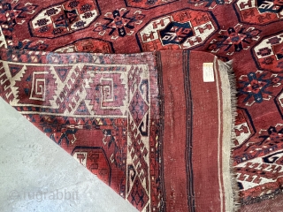 A Kyzil Ayak main carpet with a large border.  Loges dates the carpet to about 1850. The condition is good, it still has a pile except for a lower area in  ...