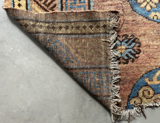 This fragment of a Khotan carpet actually shows half of a carpet and features a magnificent, beautifully drawn medallion. The carpet is in good condition, with an original ending and no restorations.  ...