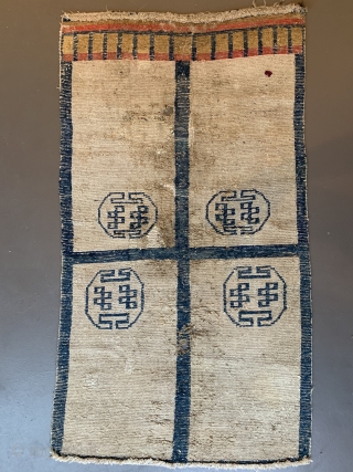 Door rug from Tibet. With some old repairs and holes.  Basically in a weak condition as you can see from the pictures. But it is the rare and early type of  ...