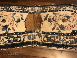 lovely white ground ningxia saddle rug, west china, 19th century, 130 x 58 cm, 4'3" x 1'11", upper ends open, one half partly worn, no restoration       