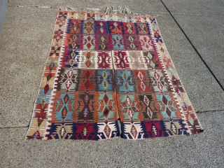 Anatolian kilim-half  which someone cut in half (probably for display purposes--could be rejoined fairly easily).  Some of the dies are "hot" transitional colors, but still a piece with great workmanship  ...