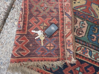 SOLD   THANK YOU!   Antique Caucasian pile rug in somewhat distressed condition.  Unusual pattern and a rich array of intriguing colors and designs,  Rings on back indicate  ...