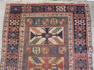 SOLD   THANK YOU!   Antique Caucasian pile rug in somewhat distressed condition.  Unusual pattern and a rich array of intriguing colors and designs,  Rings on back indicate  ...