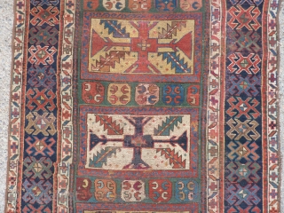 SOLD   THANK YOU!   Antique Caucasian pile rug in somewhat distressed condition.  Unusual pattern and a rich array of intriguing colors and designs,  Rings on back indicate  ...