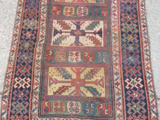 SOLD   THANK YOU!   Antique Caucasian pile rug in somewhat distressed condition.  Unusual pattern and a rich array of intriguing colors and designs,  Rings on back indicate  ...