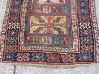 SOLD   THANK YOU!   Antique Caucasian pile rug in somewhat distressed condition.  Unusual pattern and a rich array of intriguing colors and designs,  Rings on back indicate  ...