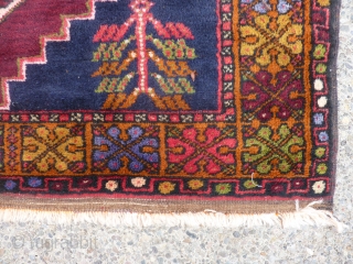 Decorative semi-antique Turkish rug in excellent condition 49" x 70" dazzling colors in border.                   