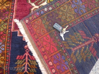 Decorative semi-antique Turkish rug in excellent condition 49" x 70" dazzling colors in border.                   