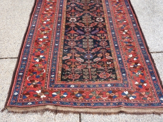 9'6" x 5'3"  spots of wear and generally low pile but a charming rug.                  