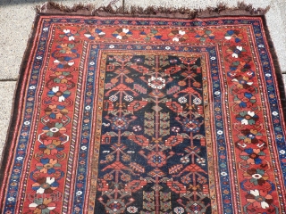 9'6" x 5'3"  spots of wear and generally low pile but a charming rug.                  