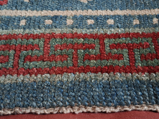 A stunning Khamdrum from mid 19th century or earlier. Both wool and dyes are sensational. 95x57 cm.

One of the best tibetan rugs I've had the pleasure to handle. Sourced in Tibet in  ...