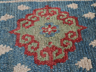 A stunning Khamdrum from mid 19th century or earlier. Both wool and dyes are sensational. 95x57 cm.

One of the best tibetan rugs I've had the pleasure to handle. Sourced in Tibet in  ...