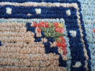 Great tibetan upper saddle from early 20th century with an archaic medallion, frog feet and Tigma motif in the border. Lustrous wool with all organic dyes. Wool weft and cotton warp. Red  ...