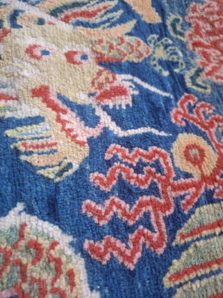 Tibetan Khagangma with a dragon and bird Phoenix. Probably 1930's.  Wool on cotton. 
Dense weave and superp wool and colors.
A little gem.
Just back from professional cleaning. 
One side needs attention 
65x59  ...
