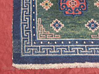 A wonderful tibetan Khaden with rare green.Three Eastturkestan inspired medallions. Late 19th century.  All wool. Bought in Kathmandu 1989 and with me ever since.86x154
cm. One professionally executed repair in the outer  ...