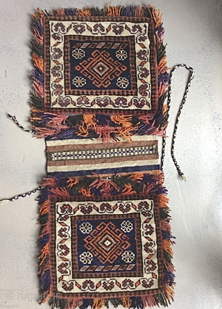 Persian double saddlebag Khorjin 

34.5 in (88 cm) x 15 in (37.5 cm). 20th century, possibly 1920s.

Intact.  In good condition.  Decorative fringes with some fading, presumably some aniline dye.

Contact:   ...
