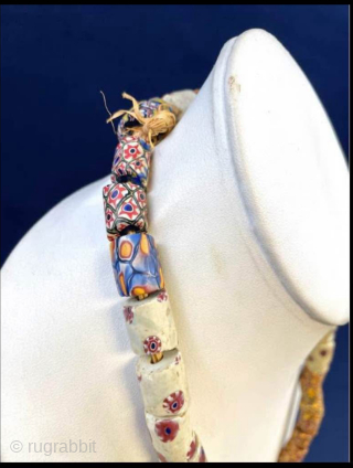 Millefiori African Trade Beads Necklace. Intricately designed mosaic-pattern glass beaded necklace with vibrant patterns. Age circa 1900.  Nearly 50 beads make up this necklace! 

These mosaic glass beads were used as  ...