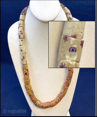 Millefiori African Trade Beads Necklace. Intricately designed mosaic-pattern glass beaded necklace with vibrant patterns. Age circa 1900.  Nearly 50 beads make up this necklace! 

These mosaic glass beads were used as  ...
