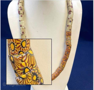 Millefiori African Trade Beads Necklace. Intricately designed mosaic-pattern glass beaded necklace with vibrant patterns. Age circa 1900.  Nearly 50 beads make up this necklace! 

These mosaic glass beads were used as  ...