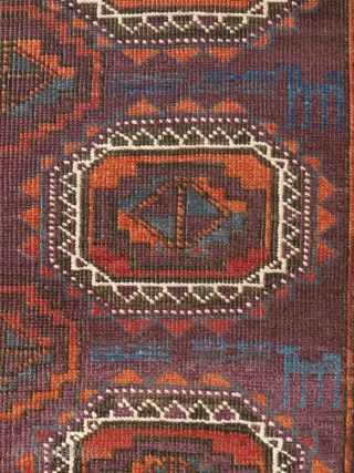 # 1127 Rare symmetrically knotted rug, "Baluch Tradition", with Turkmen guls, 109/156 cm, Khorasan (?), late 19th century, unusual palette of secondary colours (Orange, Aubergine, Green), all of natural origin, contrasted by  ...