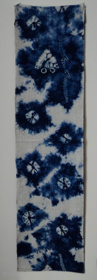Indigo Kumo Shibori ‘zoikin’, Japan, Taisho (c.1920), 134x33cm. The common English translation of the Japanese word shibori is "tie-dye". However, a more accurate translation is "shaped-resist dyeing," which describes the inherent patterning  ...