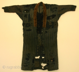 BORO noragi, Japan, late Meiji (circa 1900), cm 117x123. This is a very incredible noragi (work coat) made of recycled indigo dyed cottons; in other words it is a ‘boro’ jacket that  ...