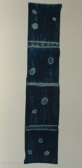 Indigo shibori panel, Japan, Taisho (c.1920), 165x33cm. The common English translation of the Japanese word shibori is "tie-dye"; however, a more accurate translation is "shaped-resist dyeing," which describes the inherent patterning process  ...