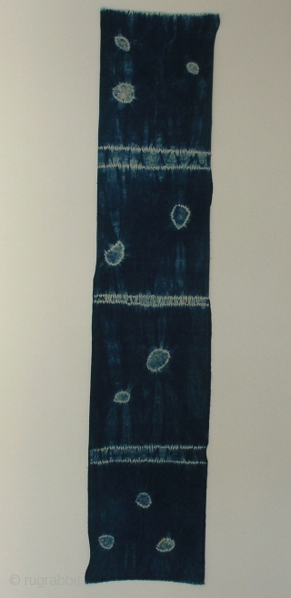 Indigo shibori panel, Japan, Taisho (c.1920), 165x33cm. The common English translation of the Japanese word shibori is "tie-dye"; however, a more accurate translation is "shaped-resist dyeing," which describes the inherent patterning process  ...