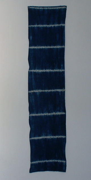 Indigo shibori panel, Japan, Taisho (c.1920), 151x33cm. The common English translation of the Japanese word shibori is "tie-dye"; however, a more accurate translation is "shaped-resist dyeing," which describes the inherent patterning process  ...