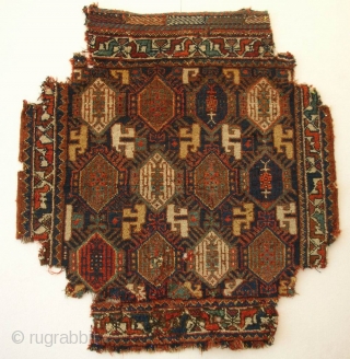 Qashqa’i khordjin, south west Persia, second half 19th century, cm 77x72. A superb bagface with bit of condition issues. Having been used as upholstery (!), it is now missing corners as you  ...