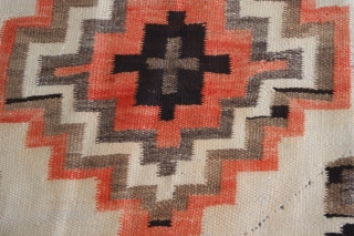 Navajo Rug

Origin: Southwest USA 
Size: 3'10"X5'4" 
Age: c. 1905 
Wool. Tapestry Weave 
Condition: very good.

The two stacked diamond medallions and the other symbols in the field are typical Navajo design elements; the  ...