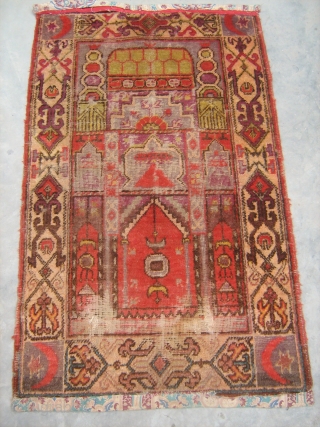 Antique Khotan prayer rug early 20th century . four crecents at the corners. mosque desing in the centre. worn at some places. size 2' x4'.
Any offers welcome regarding price.
Free worldwide shipping.  