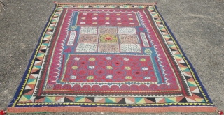 A vintage applique and patchwork ralli quilt of mid 20th century. This is a hand sewn and hand stitched traditional ralli quilt of cotton fabrics from desert Tharparkar, Pakistan.
Its size is 82"X48",  ...