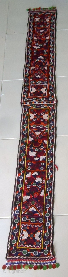 This tribal embroidered piece is called Bokani (Muffler). It is pakka hand embroidered piece with beautiful mirror-works. It was made in desert Tharparkar, Pakistan. Its size is 60"X7". The wonderful fair work. 