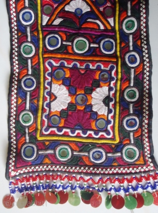 This tribal embroidered piece is called Bokani (Muffler). It is pakka hand embroidered piece with beautiful mirror-works. It was made in desert Tharparkar, Pakistan. Its size is 60"X7". The wonderful fair work. 