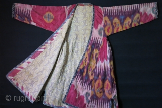 Uzbekistan Shoi - silk/ on silk quilted Chapan. Adras ikat facing and Printed cotton lining. very small minor holes in several places. Circa 1900 - size: Arm to arm 66" - 168  ...