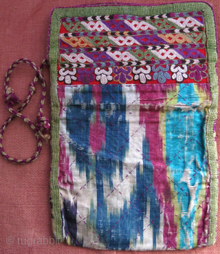 Turkmen Chodor small folding bag for valuables, silk embroidery and silk adras ikat with original securing braided string. size 8 1/2 " by 6" circa 19th cent. vedatkaradag@gmail.com     
