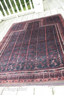 Timuri blue ground squarish prayer rug 32x35". 2 cord red and blue checker board selvages and kilim ends intact.
good condition for age. 1" band of thinning across lower 1/3rd consistent with kneeling  ...