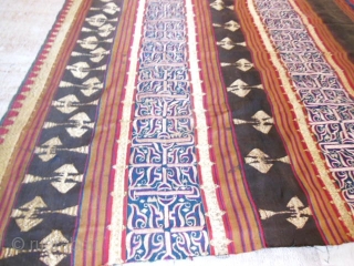 Lampung ceremonial cloth from Indonesia, South Sumatra 19c .Woven striped background cotton in shades of red madder, indigo, yellow and brown. Red and white silk embroideries with geometric patterns on indigo background.  ...