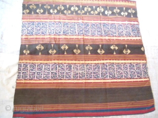 Lampung ceremonial cloth from Indonesia, South Sumatra 19c .Woven striped background cotton in shades of red madder, indigo, yellow and brown. Red and white silk embroideries with geometric patterns on indigo background.  ...