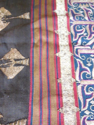 Lampung ceremonial cloth from Indonesia, South Sumatra 19c .Woven striped background cotton in shades of red madder, indigo, yellow and brown. Red and white silk embroideries with geometric patterns on indigo background.  ...