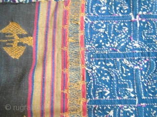 Lampung ceremonial cloth from Indonesia, South Sumatra 19c .Woven striped background cotton in shades of red madder, indigo, yellow and brown. Red and white silk embroideries with geometric patterns on indigo background.  ...