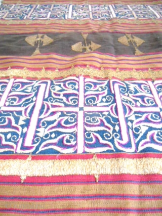 Lampung ceremonial cloth from Indonesia, South Sumatra 19c .Woven striped background cotton in shades of red madder, indigo, yellow and brown. Red and white silk embroideries with geometric patterns on indigo background.  ...