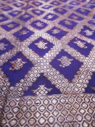 Beautiful Indian purple silk square and gold brocaded shawl originating from Varanasi in India. Varanasi or Benares in the region of Uttar Pradesh had made a specialty of this type of rich  ...