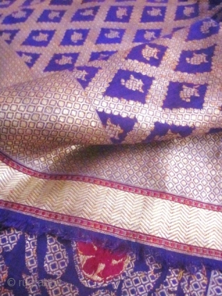 Beautiful Indian purple silk square and gold brocaded shawl originating from Varanasi in India. Varanasi or Benares in the region of Uttar Pradesh had made a specialty of this type of rich  ...