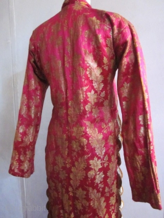 Fushia and gold brocaded satin silk Bindalli from Ottoman Empire late 19c early 20c. Usually used for ceremonial event . Beautiful brocaded fuchsia satin with gold thread and floral garlands, entirely piped  ...