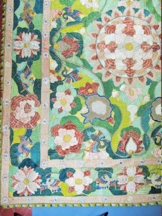 ​Chinese for export to Portugal
Silver and polychrome silk floss embroidered hanging in the Chinese manner. A large central peony is framed by pairs of birds, lotus flowers, clouds and phoenix, all derived  ...