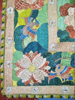 ​Chinese for export to Portugal
Silver and polychrome silk floss embroidered hanging in the Chinese manner. A large central peony is framed by pairs of birds, lotus flowers, clouds and phoenix, all derived  ...