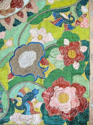 ​Chinese for export to Portugal
Silver and polychrome silk floss embroidered hanging in the Chinese manner. A large central peony is framed by pairs of birds, lotus flowers, clouds and phoenix, all derived  ...